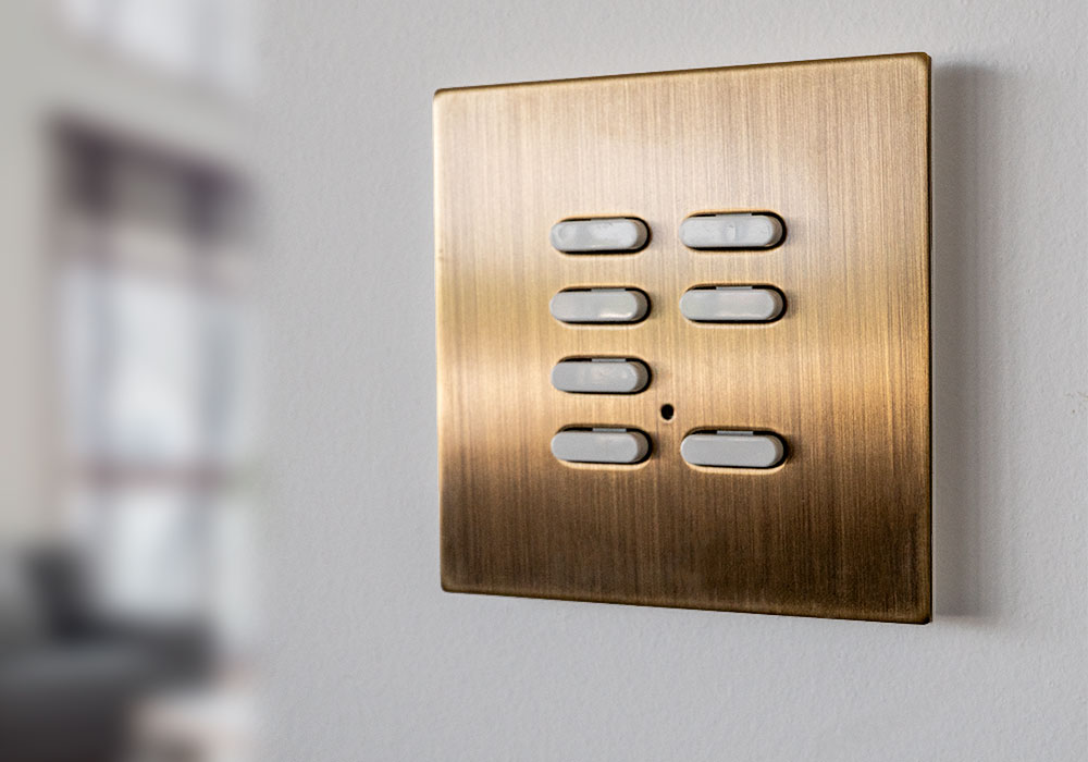 Brass keypad on a polished plaster wall